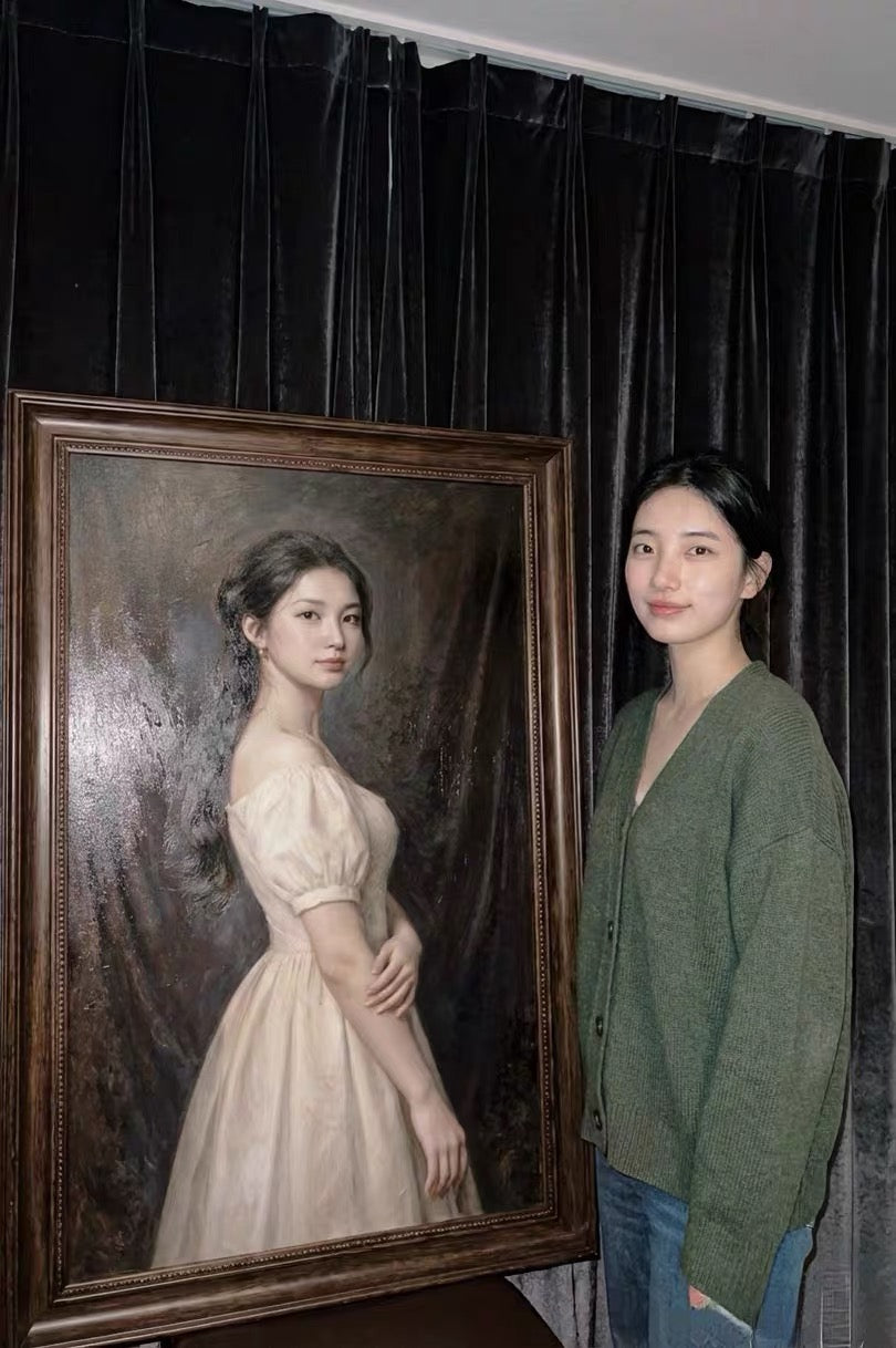 A woman stands beside a large brown-framed classical portrait of herself in a light dress against dark curtains.