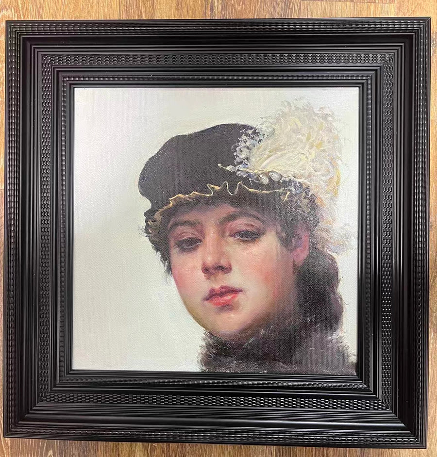 A framed classical portrait of a young woman wearing a dark hat with white feather trim against a pale background.
