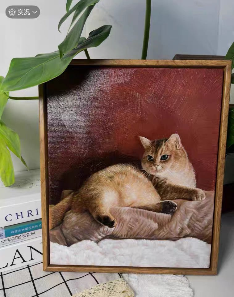 A framed contemporary pet portrait of a brown-and-white cat reclining on a cushion against a deep red background.
