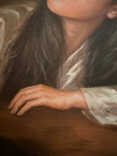 Close-up of the sitter’s hand, dark hair and embroidered silk sleeve