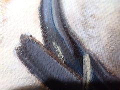 Close-up of dark ear and coat brushwork against pale fur in a classical pet portrait