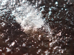 Extreme close-up of dark and white oil paint texture in a classical pet portrait