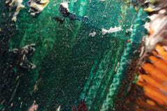 Close-up of deep green textured brushwork in an abstract cat portrait